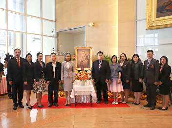 Deputy Dean for Academic Affairs College
of Nursing and Health Join give a vase
of flowers